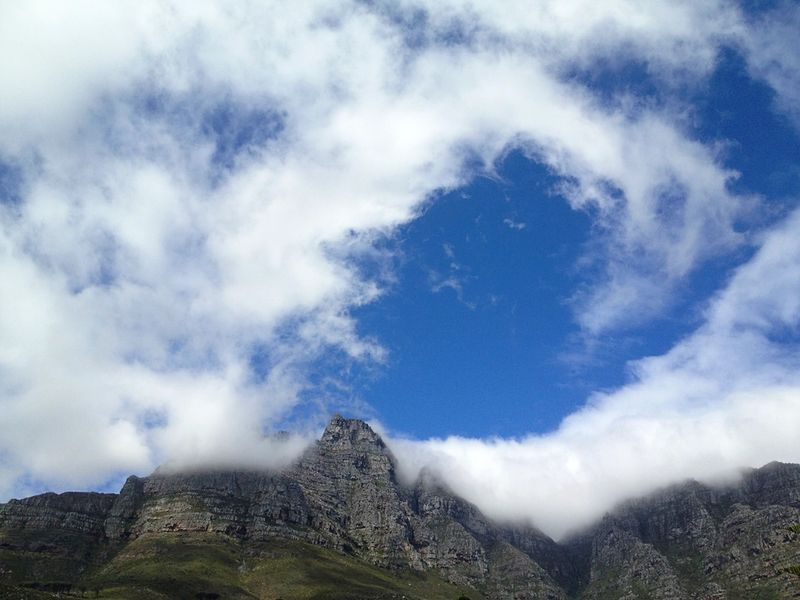 Table Mountain with cloud pouring over its flat top